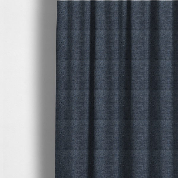 Fabric used to create these made-to-measure curtains is a navy blue woven fabric with a multi-tonal, heathered texture.
