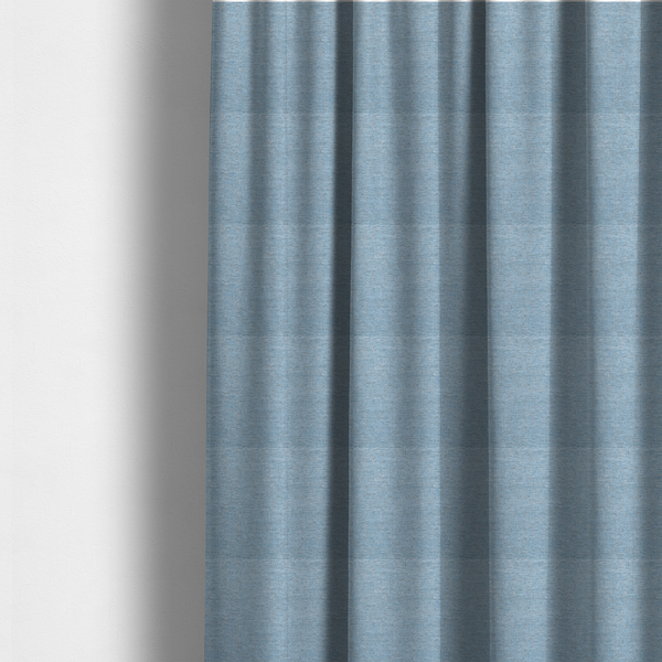 Fabric used to create these made-to-measure curtains is a sky blue woven fabric with a multi-tonal, heathered texture.