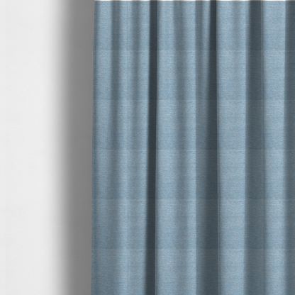 Fabric used to create these made-to-measure curtains is a sky blue woven fabric with a multi-tonal, heathered texture.