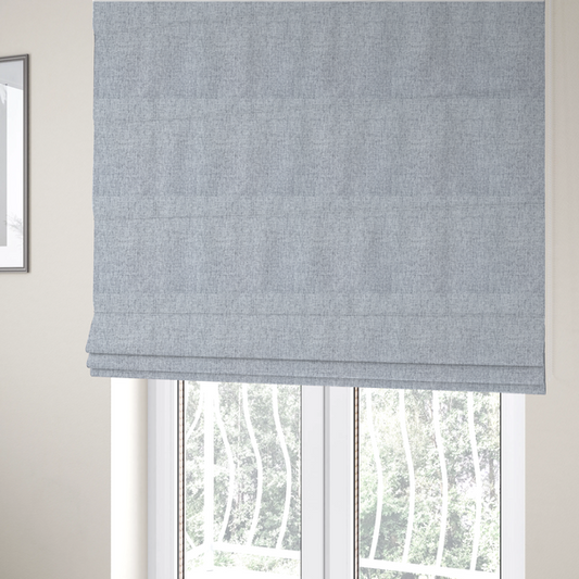 The fabric used to create these Roman blinds is a silver grey woven fabric with a clean, heathered texture.
