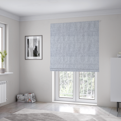 The fabric used to create these Roman blinds is a silver grey woven fabric with a clean, heathered texture.