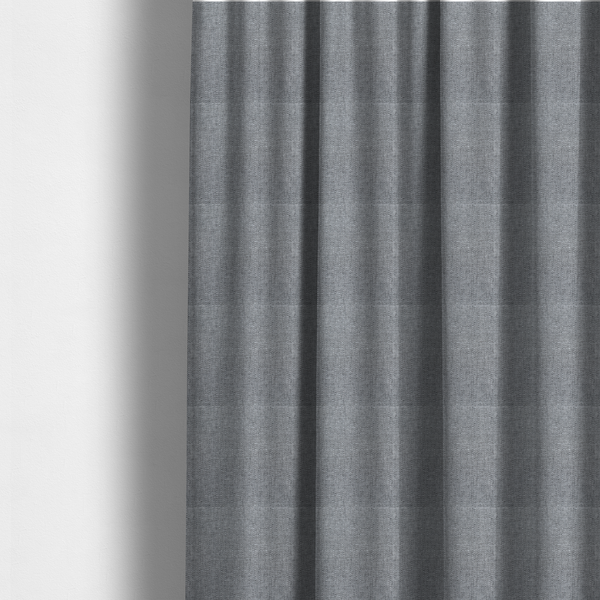 The fabric used to create these made-to-measure curtains is a steel grey woven fabric with a dense, multi-tonal heathered texture.