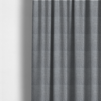 The fabric used to create these made-to-measure curtains is a steel grey woven fabric with a dense, multi-tonal heathered texture.