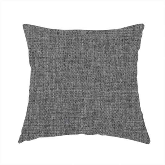 The fabric used to create this handmade cushion is a graphite grey woven fabric with a dense, multi-tonal heathered texture.