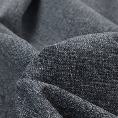 A dark charcoal grey woven fabric with a heavy, multi-tonal heathered texture.
