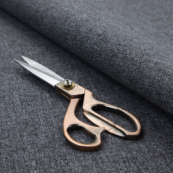 A dark charcoal grey woven fabric with a heavy, multi-tonal heathered texture.