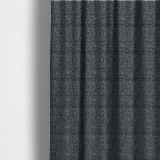 The fabric used to create these made-to-measure curtains is a dark charcoal grey woven fabric with a heavy, multi-tonal heathered texture.