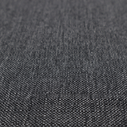 A black and grey woven fabric with a tight, salt-and-pepper heathered texture.