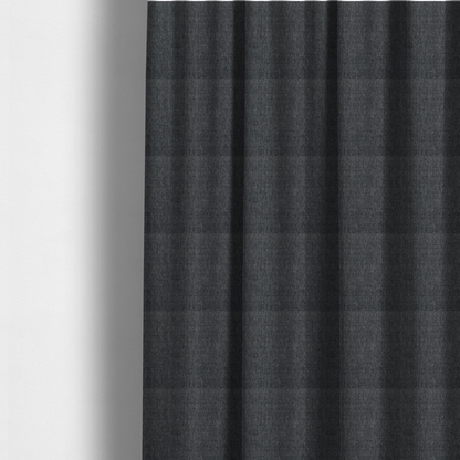 The fabric used to create these made-to-measure curtains is a black and grey woven fabric with a tight, salt-and-pepper heathered texture.