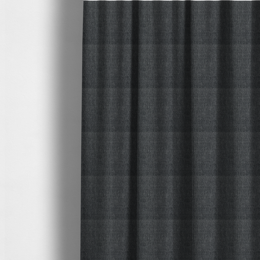 The fabric used to create these made-to-measure curtains is a black and grey woven fabric with a tight, salt-and-pepper heathered texture.