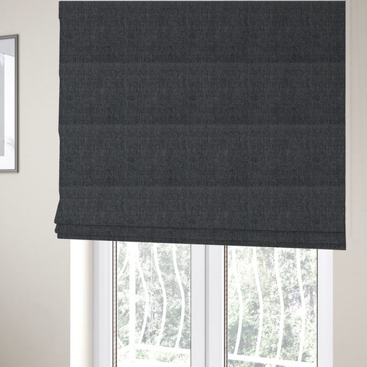 The fabric used to create these Roman blinds is a black and grey woven fabric with a tight, salt-and-pepper heathered texture.