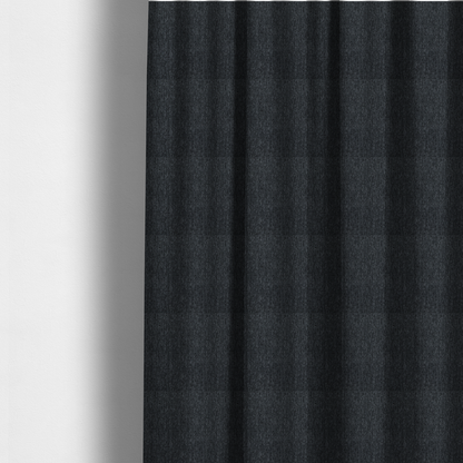 The fabric used to create these made-to-measure curtains is a deep onyx black woven fabric with a fine, heathered texture.