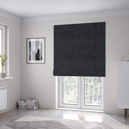 The fabric used to create these Roman blinds is a deep onyx black woven fabric with a fine, heathered texture.