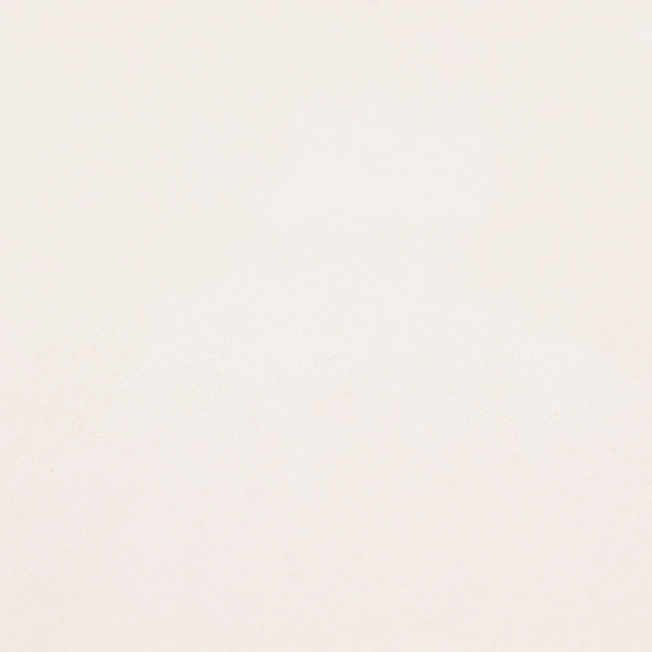 Annecy Water Repellent Velvet in Cream. The fabric features a dense, soft pile with a subtle matte sheen. The warm, off-white cream tone is uniform throughout, offering a luxurious and durable finish suitable for high-end upholstery.