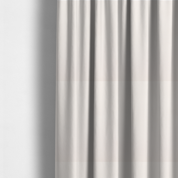 The fabric used to create these curtains features a dense, soft pile with a subtle matte sheen. The warm, off-white cream tone is uniform throughout, offering a luxurious and durable finish suitable for high-end upholstery.