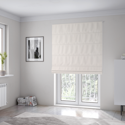 The fabric used to create these Roman blinds features a dense, soft pile with a subtle matte sheen. The warm, off-white cream tone is uniform throughout, offering a luxurious and durable finish suitable for high-end upholstery.