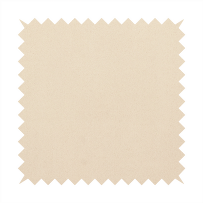 Annecy Water Repellent Velvet in Champagne. The fabric features a fine, dense pile with a soft matte finish in a pale, sandy-beige tone. This high-performance upholstery material offers a luxurious feel with built-in moisture resistance for added durability.