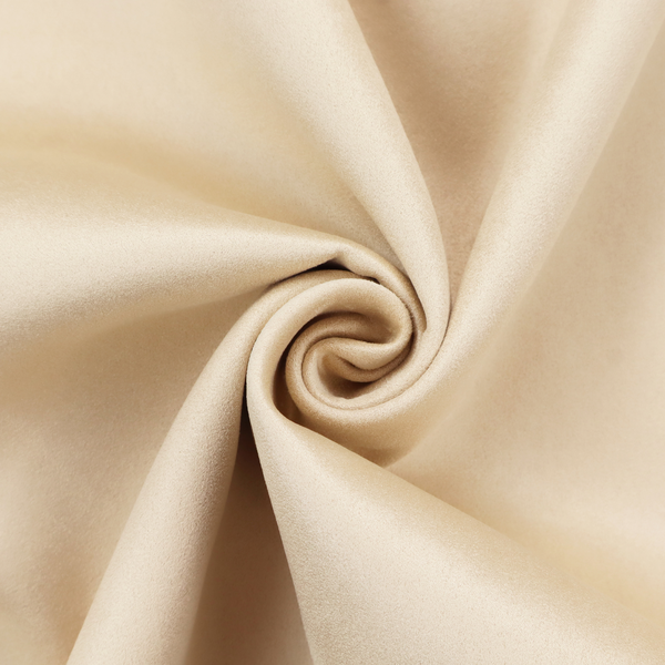 Annecy Water Repellent Velvet in Champagne. The fabric features a fine, dense pile with a soft matte finish in a pale, sandy-beige tone. This high-performance upholstery material offers a luxurious feel with built-in moisture resistance for added durability.