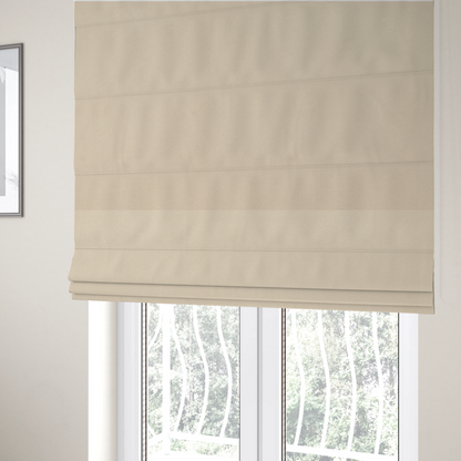 the fabric used to create these Roman blinds features a fine, dense pile with a soft matte finish in a pale, sandy-beige tone. This high-performance upholstery material offers a luxurious feel with built-in moisture resistance for added durability.