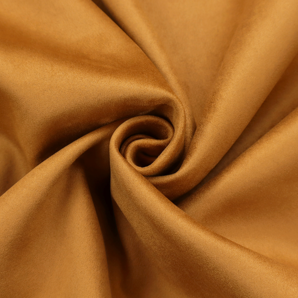 Annecy Water Repellent Velvet in Ochre. The fabric features a rich, dense pile with a soft matte finish in a warm, earthy mustard-orange tone. This high-performance upholstery material combines a luxurious feel with a specialized water-resistant coating for enhanced durability.