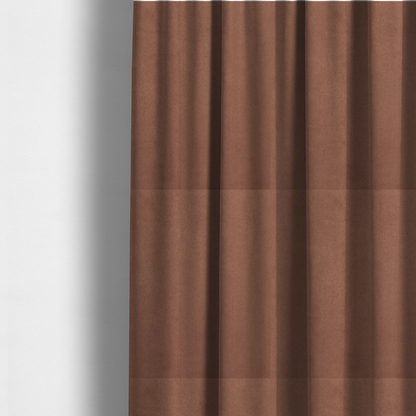 The fabric used to create these made-to-measure curtains features a dense, plush pile with a soft matte finish in a warm, muted clay-red tone. This high-performance upholstery material offers a luxurious feel combined with a specialized water-resistant coating for lasting durability.