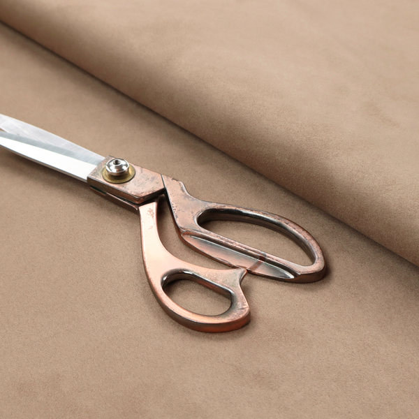 Annecy Water Repellent Velvet in Taupe. The fabric showcases a dense, plush pile with a soft matte finish in a classic, neutral brownish-grey tone. This high-performance upholstery material offers a luxurious texture combined with a specialized water-resistant coating for practical, everyday use.