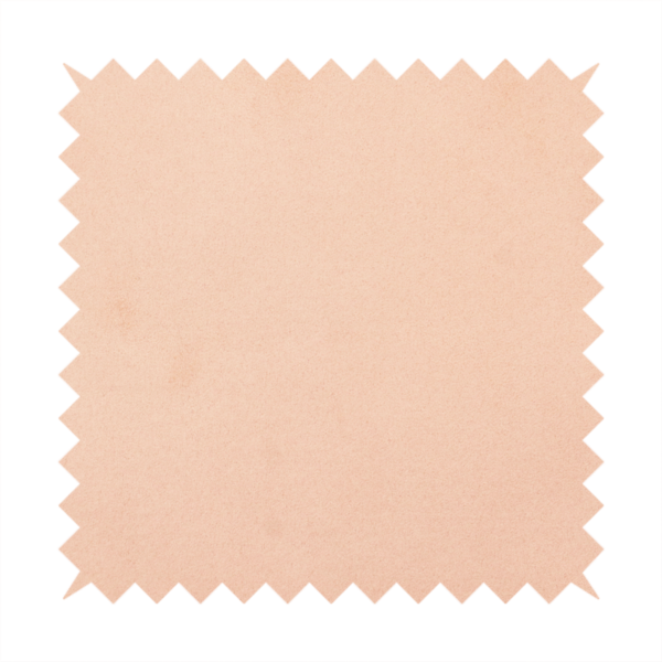 Annecy Water Repellent Velvet in Blush. The fabric features a dense, soft pile with a matte finish in a delicate, pale peachy-pink tone. This high-performance upholstery material offers a luxurious feel and a specialized water-resistant coating, making it both elegant and durable.