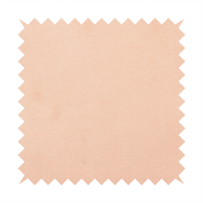 Annecy Water Repellent Velvet in Blush. The fabric features a dense, soft pile with a matte finish in a delicate, pale peachy-pink tone. This high-performance upholstery material offers a luxurious feel and a specialized water-resistant coating, making it both elegant and durable.