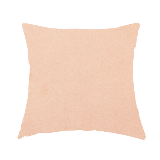 The fabric used to create this handmade cushion features a dense, soft pile with a matte finish in a delicate, pale peachy-pink tone. This high-performance upholstery material offers a luxurious feel and a specialized water-resistant coating, making it both elegant and durable.