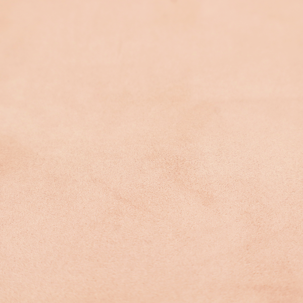 Annecy Water Repellent Velvet in Blush. The fabric features a dense, soft pile with a matte finish in a delicate, pale peachy-pink tone. This high-performance upholstery material offers a luxurious feel and a specialized water-resistant coating, making it both elegant and durable.