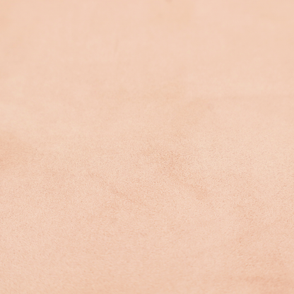Annecy Water Repellent Velvet in Blush. The fabric features a dense, soft pile with a matte finish in a delicate, pale peachy-pink tone. This high-performance upholstery material offers a luxurious feel and a specialized water-resistant coating, making it both elegant and durable.