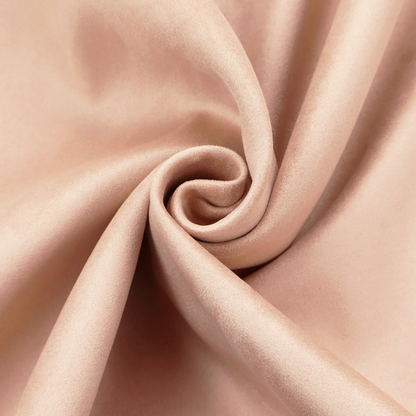 Annecy Water Repellent Velvet in Blush. The fabric features a dense, soft pile with a matte finish in a delicate, pale peachy-pink tone. This high-performance upholstery material offers a luxurious feel and a specialized water-resistant coating, making it both elegant and durable.