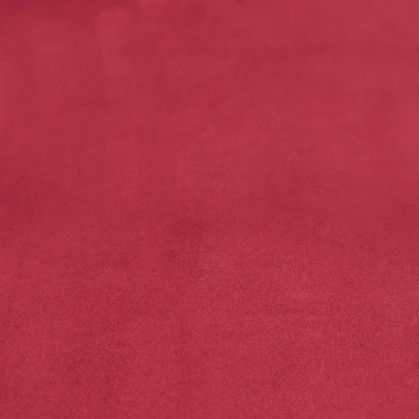 Annecy Water Repellent Velvet in Wine. The fabric features a dense, plush pile with a soft matte finish in a rich, vibrant crimson-red tone. This high-performance upholstery material offers a luxurious feel and a specialized water-resistant coating for superior durability and style.