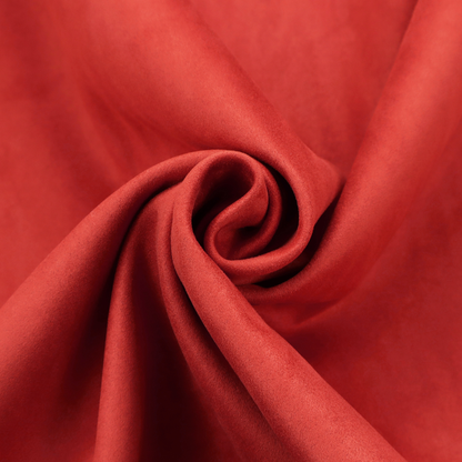 Annecy Water Repellent Velvet in Red. The fabric features a dense, plush pile with a soft matte finish in a bold, classic primary red. This high-performance upholstery material offers a luxurious feel and a specialized water-resistant coating for superior durability and a vibrant look.