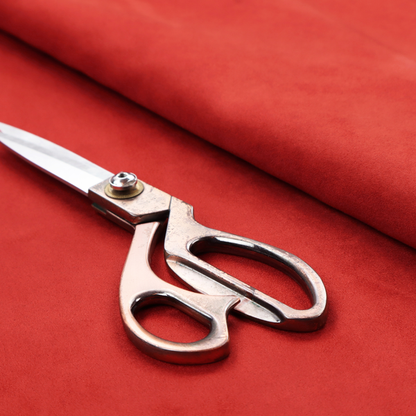 Annecy Water Repellent Velvet in Red. The fabric features a dense, plush pile with a soft matte finish in a bold, classic primary red. This high-performance upholstery material offers a luxurious feel and a specialized water-resistant coating for superior durability and a vibrant look.