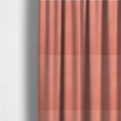 The fabric used to create these made-to-measure curtains  features a dense, plush pile with a soft matte finish in a warm, vibrant pinkish-orange tone. This high-performance upholstery material offers a luxurious feel combined with a specialized water-resistant coating for enhanced durability and a fresh, modern look.
