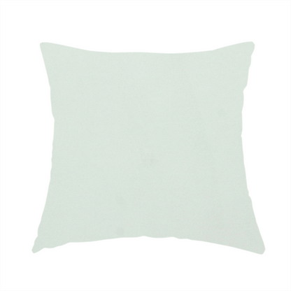 The fabric used to create this handmade cushion features a dense, plush pile with a soft matte finish in a very pale, cool-toned minty blue. This high-performance upholstery material offers a luxurious feel and a specialized water-resistant coating for superior durability and a serene, modern aesthetic.