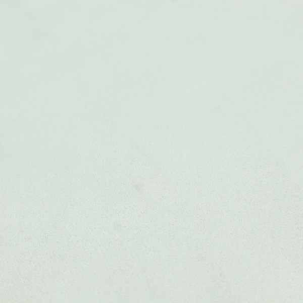 Annecy Water Repellent Velvet in Duck Egg. The fabric features a dense, plush pile with a soft matte finish in a very pale, cool-toned minty blue. This high-performance upholstery material offers a luxurious feel and a specialized water-resistant coating for superior durability and a serene, modern aesthetic.