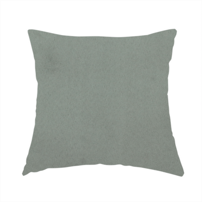 The fabric used to create this handmade cushion features a dense, plush pile with a soft matte finish in a sophisticated, muted earthy green. This high-performance upholstery material offers a luxurious feel and a specialized water-resistant coating for enhanced durability and a natural, calming aesthetic.