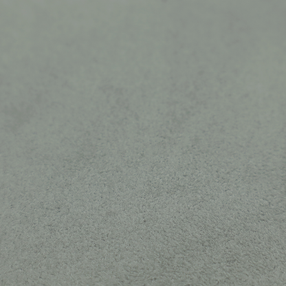 Annecy Water Repellent Velvet in Sage. The fabric features a dense, plush pile with a soft matte finish in a sophisticated, muted earthy green. This high-performance upholstery material offers a luxurious feel and a specialized water-resistant coating for enhanced durability and a natural, calming aesthetic.