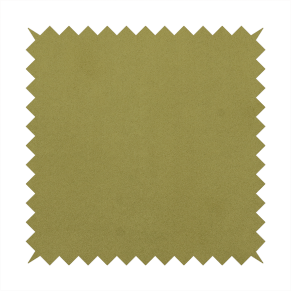 Annecy Water Repellent Velvet in Olive. The fabric features a dense, plush pile with a soft matte finish in a warm, mossy green tone. This high-performance upholstery material offers a luxurious feel and a specialized water-resistant coating for superior durability and a timeless, organic look.