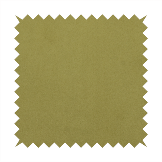 Annecy Water Repellent Velvet in Olive. The fabric features a dense, plush pile with a soft matte finish in a warm, mossy green tone. This high-performance upholstery material offers a luxurious feel and a specialized water-resistant coating for superior durability and a timeless, organic look.