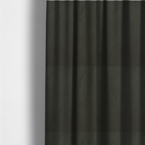 The fabric used to create these made-to-measure curtains features a dense, plush pile with a soft matte finish in a deep, rich evergreen shade. This high-performance upholstery material offers a luxurious feel and a specialized water-resistant coating for superior durability and a classic, sophisticated look.