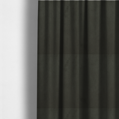 The fabric used to create these made-to-measure curtains features a dense, plush pile with a soft matte finish in a deep, rich evergreen shade. This high-performance upholstery material offers a luxurious feel and a specialized water-resistant coating for superior durability and a classic, sophisticated look.