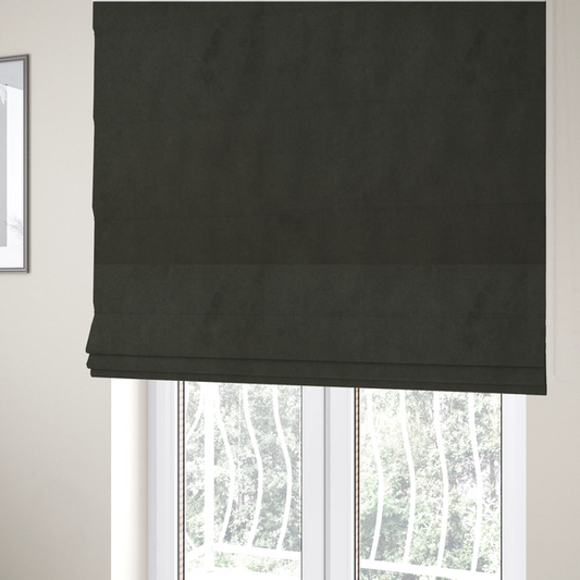 The fabric used to create these Roman blinds features a dense, plush pile with a soft matte finish in a deep, rich evergreen shade. This high-performance upholstery material offers a luxurious feel and a specialized water-resistant coating for superior durability and a classic, sophisticated look.