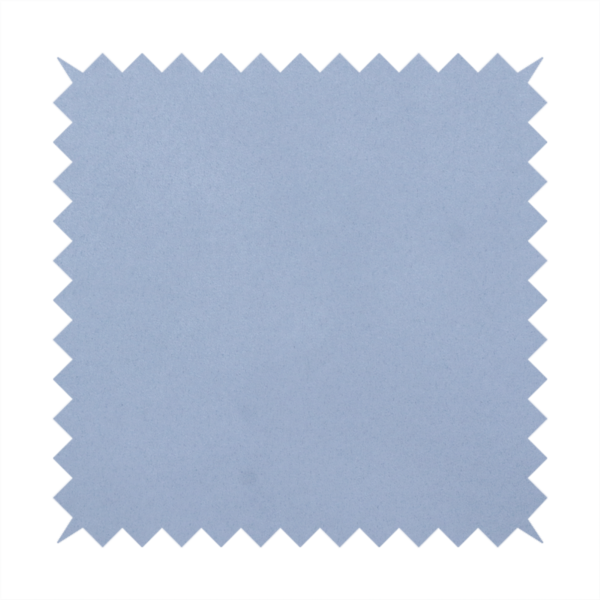 Annecy Water Repellent Velvet in Sky Blue. The fabric showcases a dense, uniform pile in a soft, serene powder blue. This high-performance upholstery material combines a luxurious matte aesthetic with a water-resistant finish, perfect for durable yet stylish furniture.
