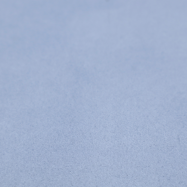 Annecy Water Repellent Velvet in Sky Blue. The fabric showcases a dense, uniform pile in a soft, serene powder blue. This high-performance upholstery material combines a luxurious matte aesthetic with a water-resistant finish, perfect for durable yet stylish furniture.