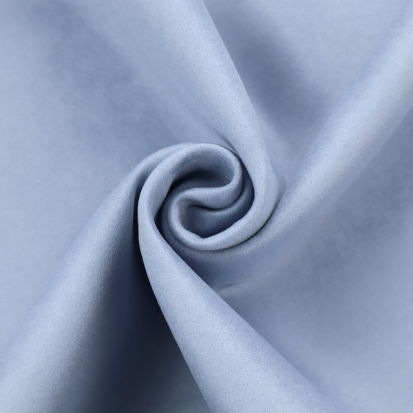 Annecy Water Repellent Velvet in Sky Blue. The fabric showcases a dense, uniform pile in a soft, serene powder blue. This high-performance upholstery material combines a luxurious matte aesthetic with a water-resistant finish, perfect for durable yet stylish furniture.