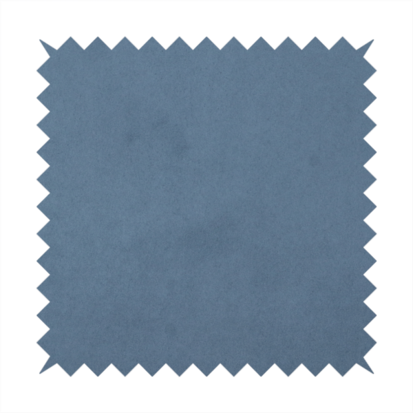 Annecy Water Repellent Velvet in Steel Blue. The fabric features a dense, plush pile with a soft matte finish in a sophisticated, mid-toned greyish-blue. This high-performance upholstery material offers a luxurious feel and a specialized water-resistant coating for superior durability and a calm, modern look.