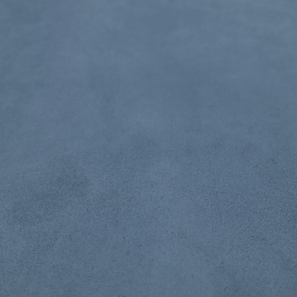 Annecy Water Repellent Velvet in Steel Blue. The fabric features a dense, plush pile with a soft matte finish in a sophisticated, mid-toned greyish-blue. This high-performance upholstery material offers a luxurious feel and a specialized water-resistant coating for superior durability and a calm, modern look.